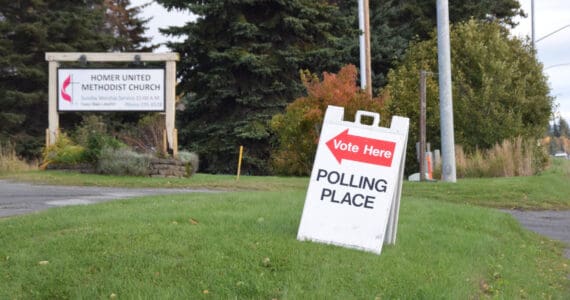 A sign outside the Homer United Methodist Church says "Vote Here," designating it as the polling location for Homer No. 2 precinct on Tuesday, Oct. 7, 2025, in Homer, Alaska. (Delcenia Cosman/Homer News)
