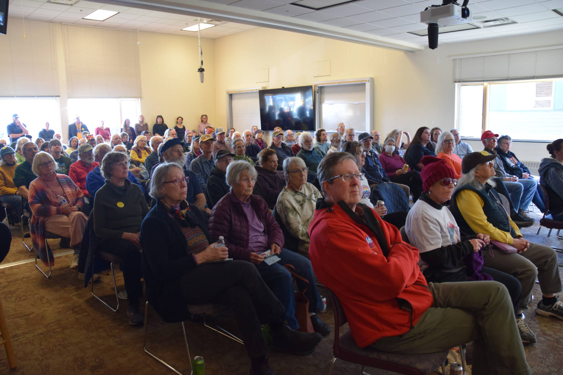 More than 100 community members packed into a combined classroom in Pioneer Hall during the Citizen’s Town Hall meeting on Saturday, Oct. 18, 2025, at Kachemak Bay Campus in Homer, Alaska. Approximately 30-40 additional audience members were seated in an overflow area in the Pioneer Hall commons. (Delcenia Cosman/Homer News)