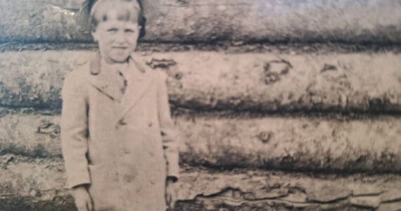 Emmett Krefting, age 6-7, at the Wible mining camping in 1907-07, about the time he first met King David Thurman. (Photo from the cover of Krefting’s memoir, Alaska’s Sourdough Kid)