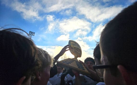 The Homer Mariners varsity football team celebrates their victory after the Division III state championships game on Saturday, Oct. 18, 2025, in Wasilla, Alaska. Photo provided by Justin Zank