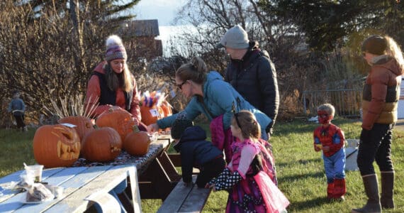 Community members attending Homer Chamber of Commerce’s third annual Fall Fest vote for their favorite pumpkin created during the event’s Pumpkin Carving Contest on Saturday, Oct. 26, 2024, at the Homer Chamber of Commerce and Visitor Center in Homer, Alaska. (Delcenia Cosman/Homer News)