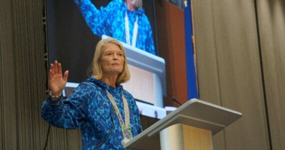 U.S. Sen. Lisa Murkowski, R-Alaska, speaks on Oct. 18, 2025, at the Alaska Federation of Natives convention in Anchorage. Behind her is a screen projeting her image as she speaks. (Photo by Yereth Rosen/Alaska Beacon)