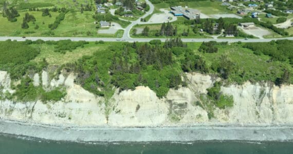 An aerial photograph shows the coastal bluff running parallel to the Sterling Highway in Homer, Alaska. Photo courtesy of the Alaska Division of Geological and Geophysical Surveys