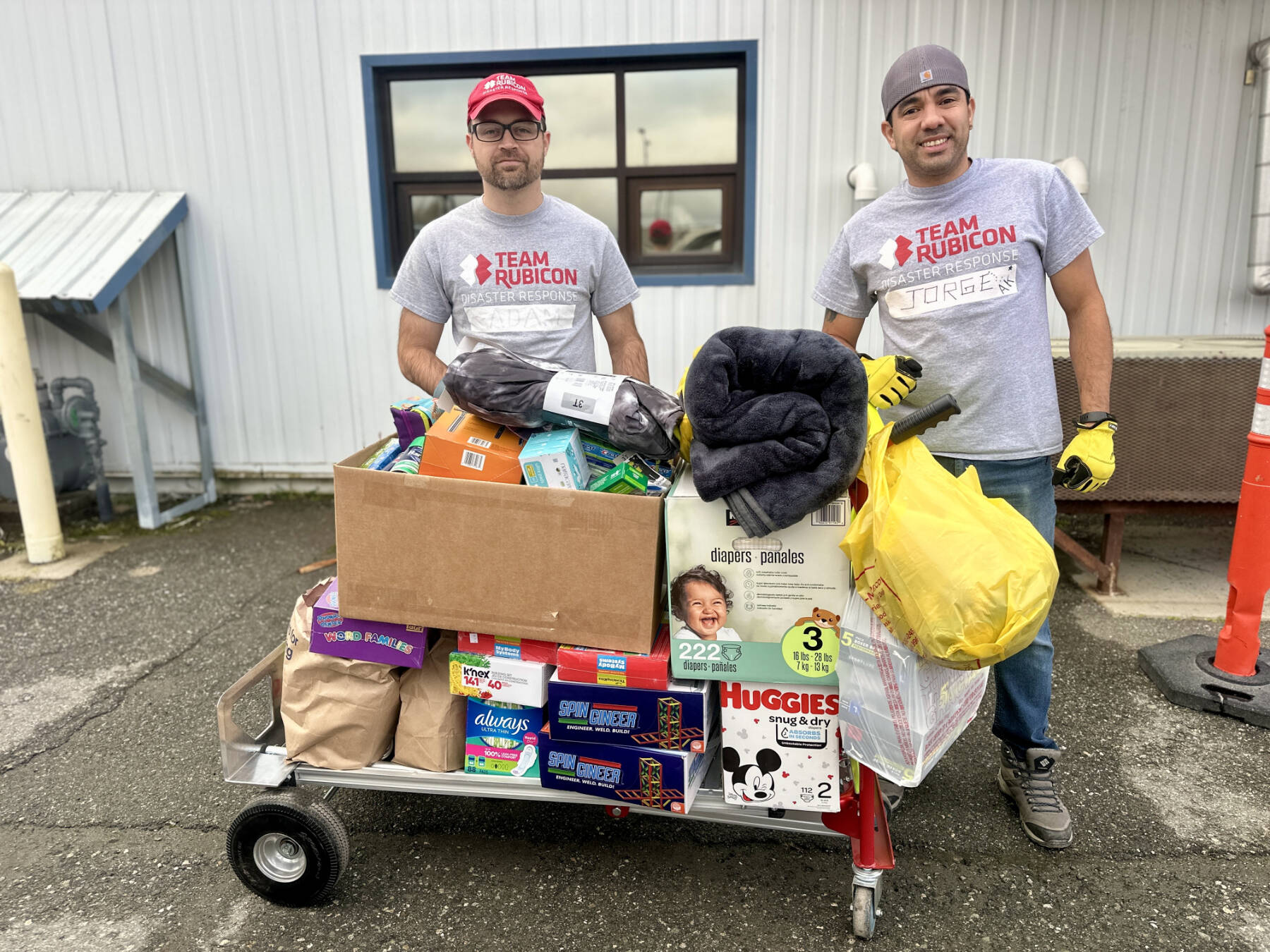 Volunteers for the Western Alaska disaster response receive one of several loads of donations from Homer area community members on Monday, Oct. 27, 2025, at the main drop-off site in Anchorage, Alaska. Photo by Christina Whiting