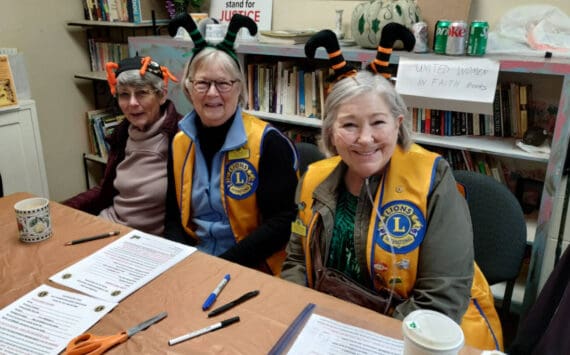 Lady Lions Marcia Lowe, Julie Small and Linda Petkash with the Homer Lions Club conduct sign-ups for Thanksgiving food boxes at the Homer United Methodist Church in Homer, Alaska. More than 230 families requested food boxes this year, an increase from 166 boxes in 2024. Photo provided by Deb Schmidt