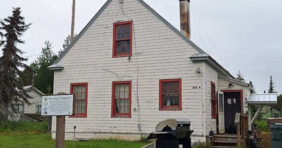 The historic marker in front of this building at 502A Overland Avenue in Kenai identifies the structure as the former headquarters of the Kenai National Wildlife Refuge and the site of the former Agricultural Experiment Station, 1899-1908. Photo by Clark Fair