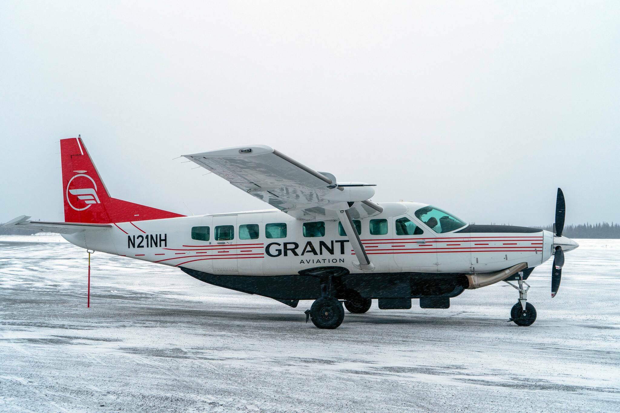 Grant Aviation’s Cessna 208B EX Grand Caravan is pictured at the Kenai Municipal Airport in Kenai, Alaska, on Monday, March 4, 2024. (Jake Dye/Peninsula Clarion)