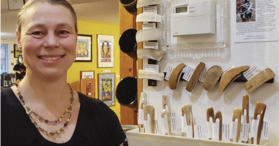 Homer resident Meriam Linder is photographed with her display of works at Ptarmigan Arts, where she is the newest co-op member. Photo provided by Meriam Linder