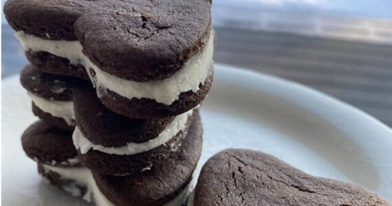 These heart-shaped chocolate sandwich cookies go perfectly with a glass of milk. (Photo by Tressa Dale/Peninsula Clarion)
