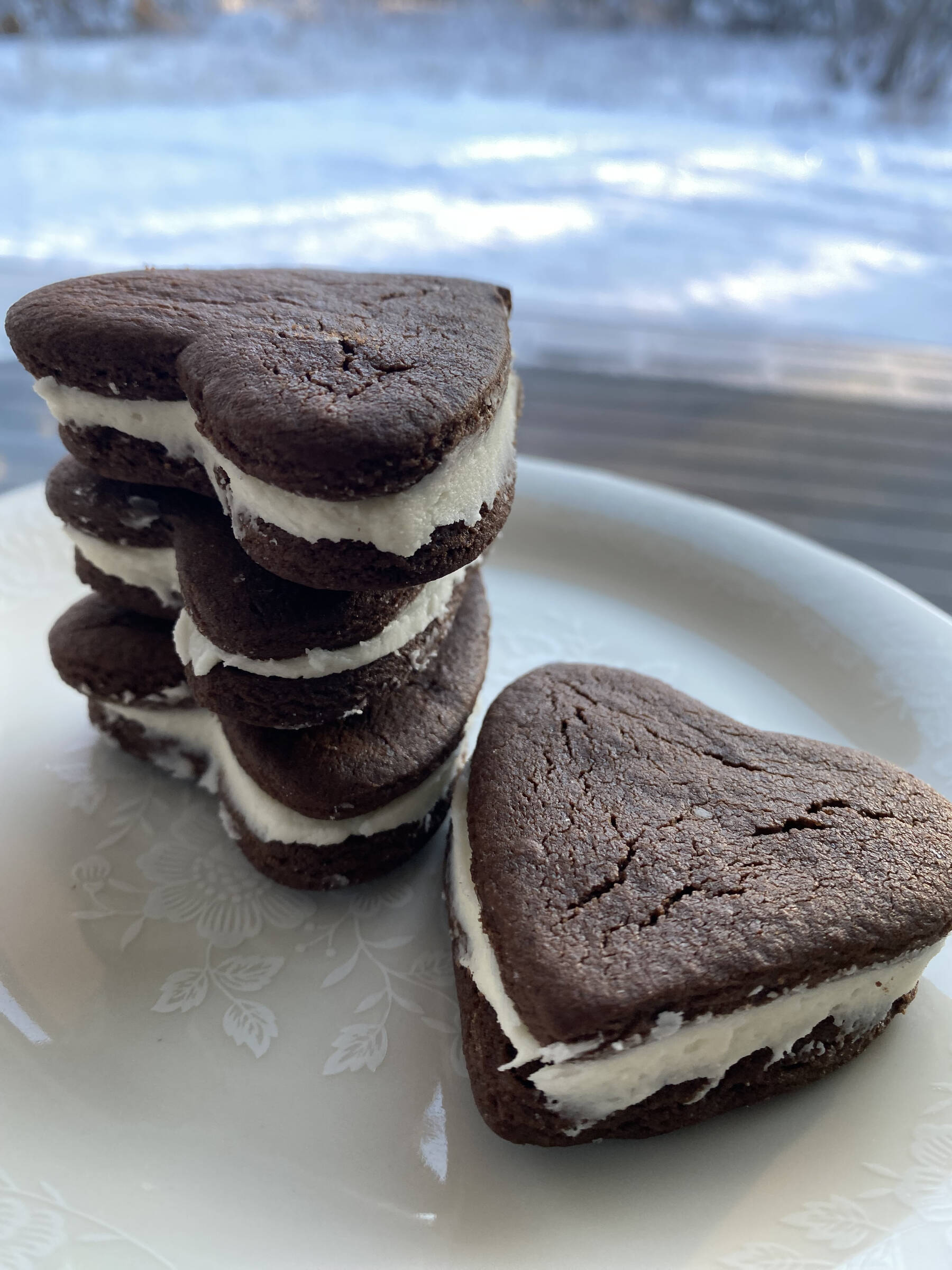 These heart-shaped chocolate sandwich cookies go perfectly with a glass of milk. (Photo by Tressa Dale/Peninsula Clarion)