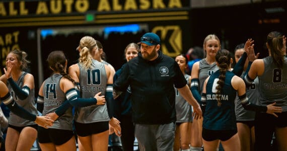 Soldotna Stars head coach Luke Baumer celebrates with the team during the state volleyball championship tournament in Anchorage during a game against the South Anchorage Wolverines on Nov. 14, 2025. Photo courtesy of Byron Corral/BC Media