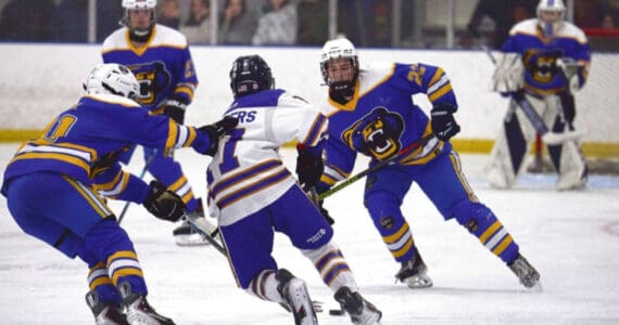 Photo courtesy Christopher Kincaid/RCKincaidPhoto
A Kodiak hockey player grabs the back of a Homer player’s jersey during the End of the Road Shootout, held Nov. 20-22 at Kevin Bell Arena.