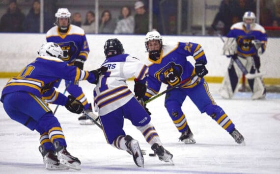 Photo courtesy Christopher Kincaid/RCKincaidPhoto
A Kodiak hockey player grabs the back of a Homer player’s jersey during the End of the Road Shootout, held Nov. 20-22 at Kevin Bell Arena.