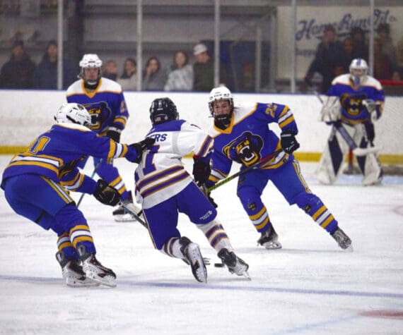 Photo courtesy Christopher Kincaid/RCKincaidPhoto
A Kodiak hockey player grabs the back of a Homer player’s jersey during the End of the Road Shootout, held Nov. 20-22 at Kevin Bell Arena.