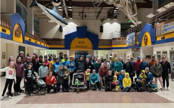 Runners of all ages gather for a photo in the Homer High School Commons after the annual Thanksgiving Turkey Trot on Thursday, Nov. 27, 2025, in Homer, Alaska. Due to icy outdoor conditions, the official run was moved to the high school halls. Photo courtesy Matthew Smith