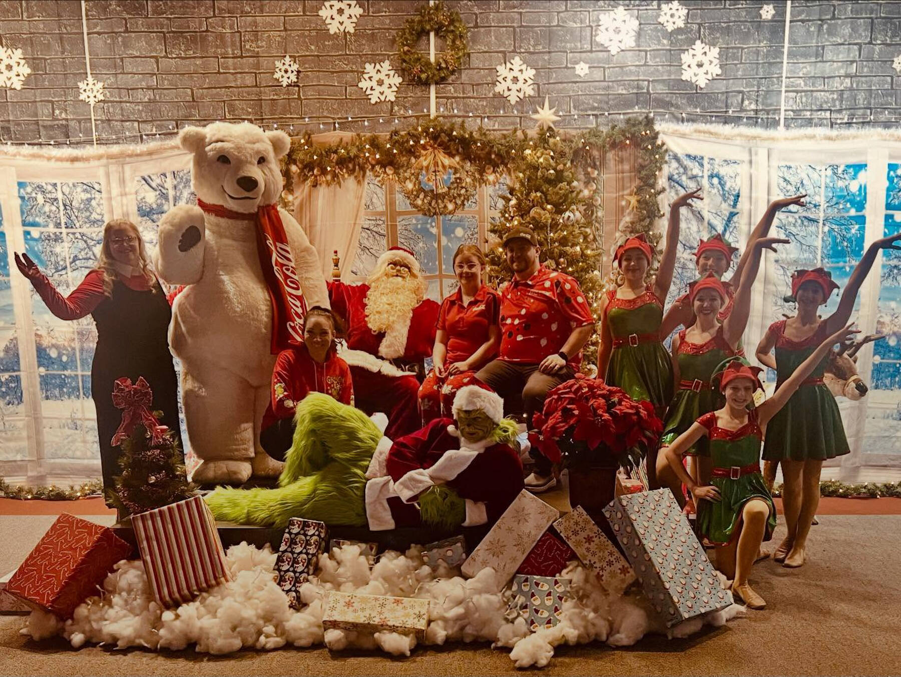 Elves from Forever Dance Alaska pose with Santa, the Grinch and the Coca-Cola polar bear during Christmas Comes to Kenai on Nov. 28, 2025. Photo courtesy of the Kenai Chamber of Commerce