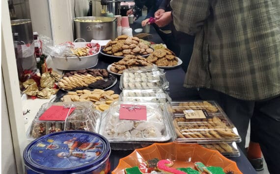 Community members enjoy a cookie and hot cocoa bar at the VFW Post 10221 after the Christmas tree lighting ceremony on Saturday, Dec. 6, 2025, in Anchor Point, Alaska. (Delcenia Cosman/Homer News)