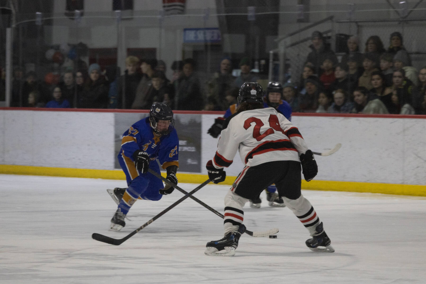 JDHS senior Isaac Phelps guards Mariners freshman Cameron Fox in front of a packed Treadwell Arena in Juneau on Friday, Jan. 23.<ins><span id="_mce_caret">, 2026</ins>