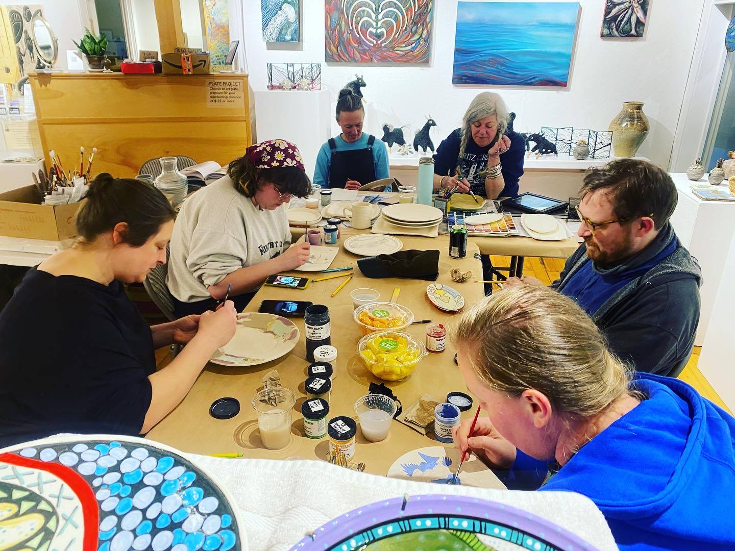 Community members gather at Bunnell Street Arts Center in 2023 for the annual Plate Painting Project. Photo provided by Bunnell Street Arts Center