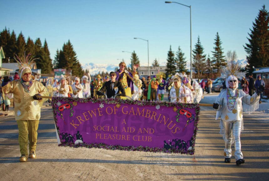 <p>The Krewe of Gambrinus, costumed for the &ldquo;Sunshine and Snowflakes&rdquo; theme, marches in the 71st annual Winter Carnival Parade on Saturday, Feb. 8, 2025, on Pioneer Avenue in Homer, Alaska. (Photo courtesy of Christopher Kincaid)</p>