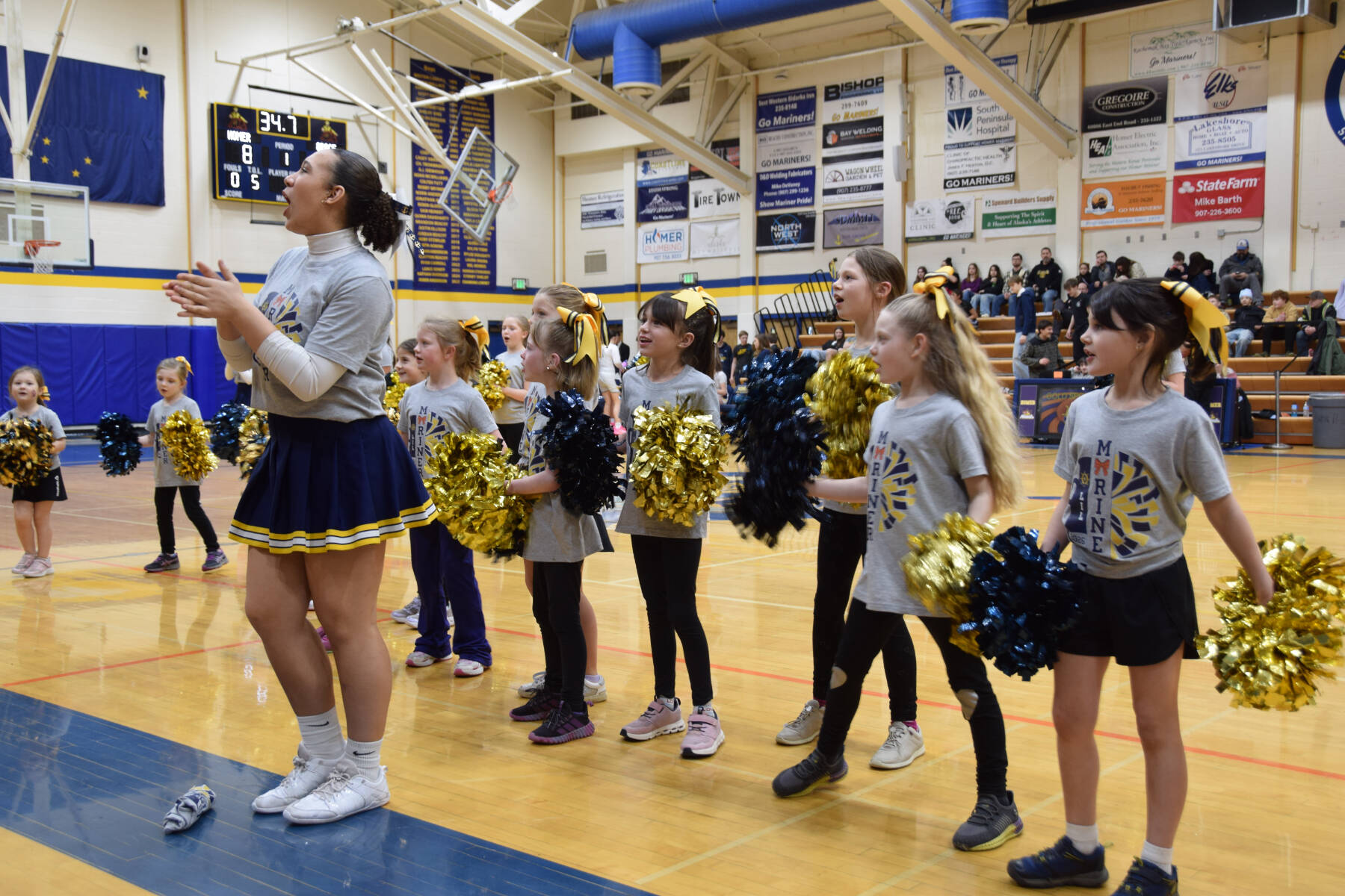 Homer High School cheerleaders lead the Lil Mariner Cheer team during the Winter Carnival basketball tournament on Saturday, Feb. 7, 2026, in Homer, Alaska. (Delcenia Cosman/Homer News)