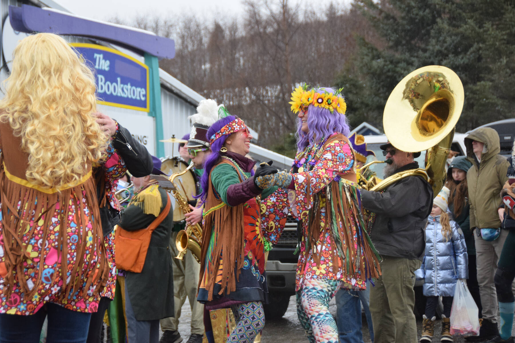 Members of the Krewe of Gambrinus perform and dance to the Beatles All You Need is Love in front of the judges station on Pioneer Avenue during the Winter Carnival Parade on Saturday, Feb. 14, 2026, in Homer, Alaska. (Delcenia Cosman/Homer News)