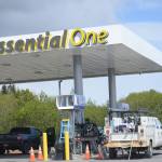 A worker with Prism Design and Construction, Wasilla, on Thursday, May 31, installs Chevron signs at the Essential One gas station on the Sterling Highway and Poopdeck Street. (Photo by Michael Armstrong/Homer News)