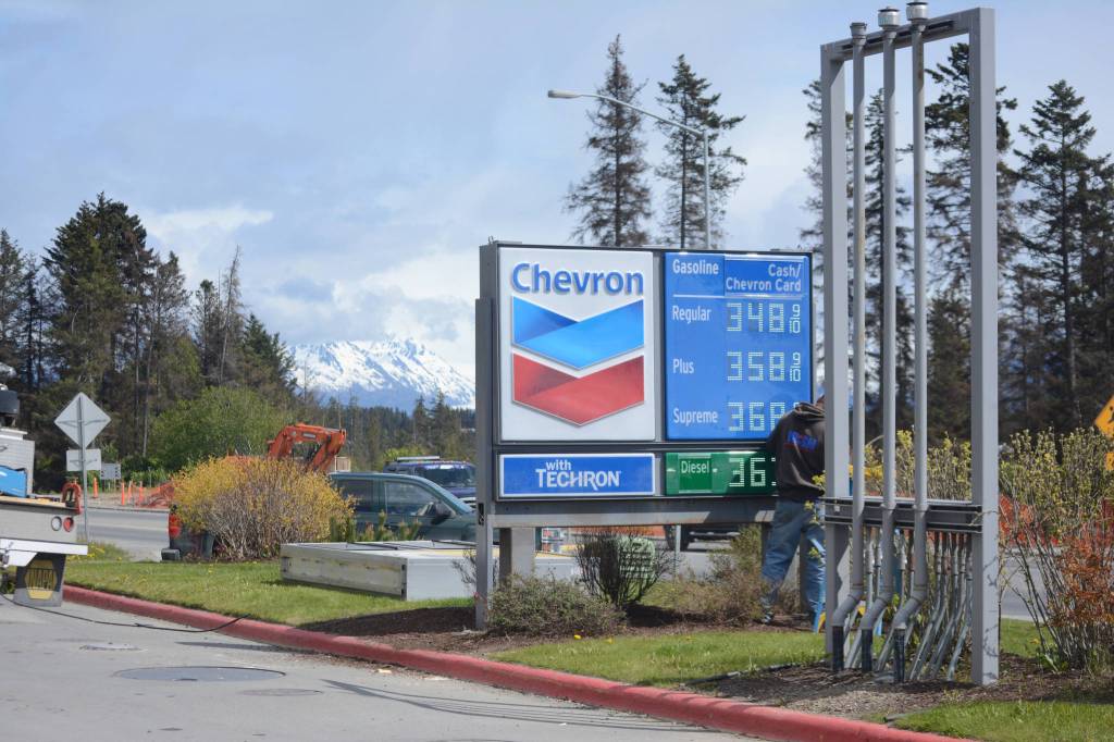 <span class="neFMT neFMT_PhotoCredit">Photo by Michael Armstrong/Homer News</span>                                A worker with Prism Design and Construction, Wasilla, on Thursday, May 31, installs Chevron signs at the former Essential One gas station on the Sterling Highway and Poopdeck Street.