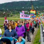 Participants in the Pride March walk over Beluga Slough on Saturday, June 23, 2018 in Homer, Alaska. (Photo by Michael Armstrong/Homer News)