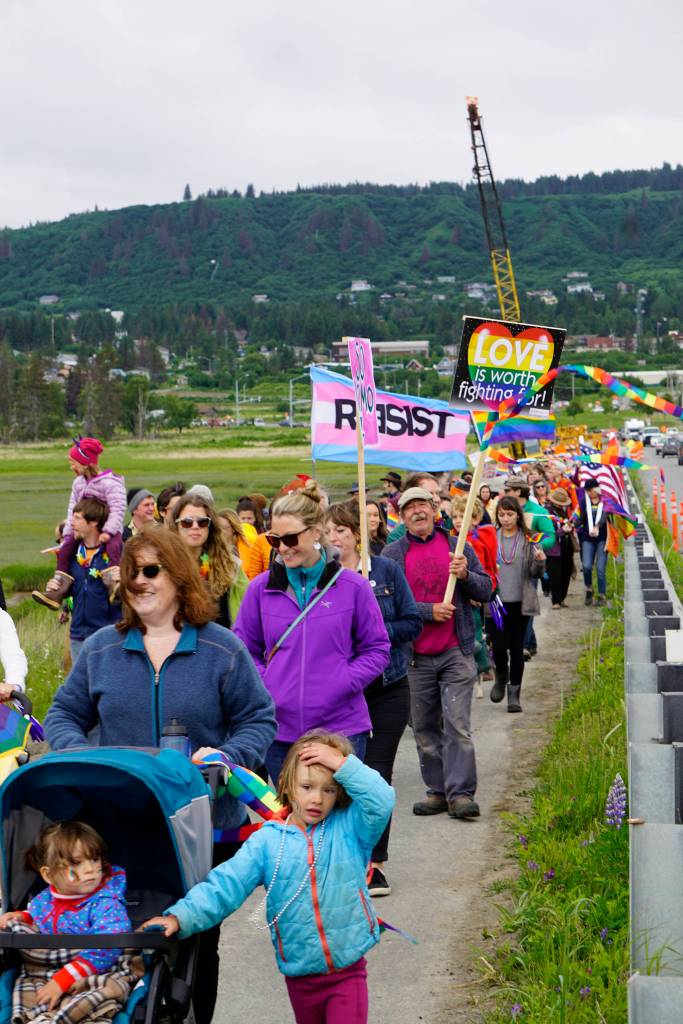 Participants in the Pride March walk over Beluga Slough on Saturday, June 23, 2018 in Homer, Alaska. (Photo by Michael Armstrong/Homer News)