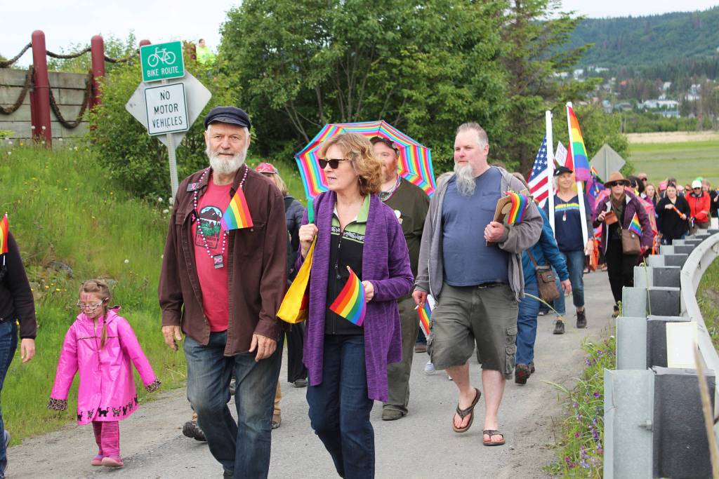 Rep. Paul Seaton (R-Homer) walks with his wife, Tina, along Ocean Drive during Homers first Pride March on Saturday, June 23, 2018 in Homer, Alaska. Several representatives of local government and the clergy participated in the march. (Photo by Megan Pacer/Homer News)