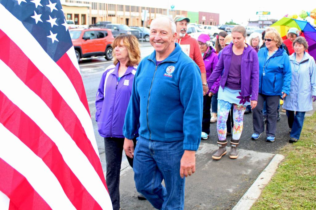 Homer Mayor Bryan Zak and Kenai Peninsula Borough Assembly member Kelly Cooper march along Pioneer Avenue during the citys first Pride March on Saturday, June 23, 2018 in Homer, Alaska. (Photo by Megan Pacer/Homer News)