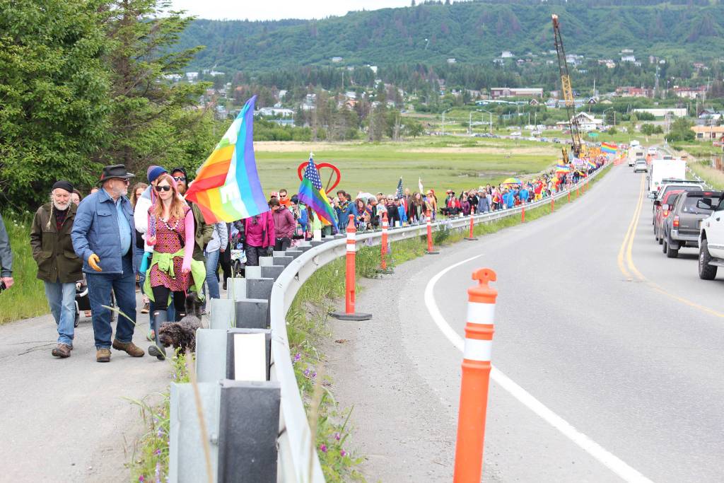Participants in Homers first ever Pride March make their way across the Beluga Slough on Saturday, June 23, 2018 in Homer, Alaska. About 280 men, women and children turned out for the event. (Photo by Megan Pacer/Homer News)