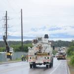 Homer Electric Association crews assess a downed line and pole on Heath Street about 3:15 p.m. Thursday, June 21. The truck in the background snagged a low-hanging telephone line, breaking a pole and bringing down a power line. The outage affected about 430 customers in downtown Homer. No one was injured in the incident. (Photo by Michael Armstrong / Homer News)