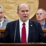 JUNEAU EMPIRE Gov. Bill Walker shakes hands with legislators as he enters the House chamber for his State of the State address before a joint session of the Alaska Legislature at the Capitol on Wednesday. Senate President Pete Kelly, R-Fairbanks, left, and Speaker of the House Bryce Edgmon, D-Dillingham, watch from the Speakers desk in the background.