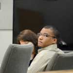 Demarqus Green listens to testimony at his trial on Friday. Green is charged with the murder of Demian Sagerser.