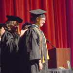 University of Alaska Regent Lisa Parker confers the master of education hood for early childhood special education on Hanna Young during Kachemak Bay Campus commencement last Wednesday.
