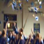 Homer High School graduates throw their caps in the air at the end of commencement exercises on Tuesday.