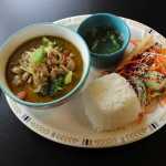 CUTLINE: Keen Kow Thai Food's green curry, served with rice, soup and salad, is an excellent opportunity for diners to put both their fork and spoon to work and discover the myriad flavors that emerge by mixing a bite of this and a bite of that.