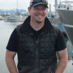Bay Welding general manager Eric Engebretsen stands on the deck of the tender King Island last Thursday at an open house for the boat at the Homer Harbor.