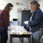 Organizers of The Exchange Megan Anderson and Ginny Espenshade fill bags with sterile cotton pellets for the safer injection kits. Intraveneous drug users without access to sterile cotton pellets use cigarette filters or cotton swabs to filter the drug as it is drawn into the syringe, said organizer Megan Anderson.