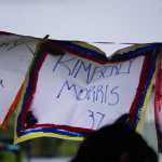 A flag of one of the Pulse night club victims flaps in the breeze last Friday at a memorial at WKFL Park.