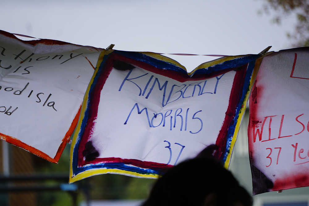 A flag of one of the Pulse night club victims flaps in the breeze last Friday at a memorial at WKFL Park.