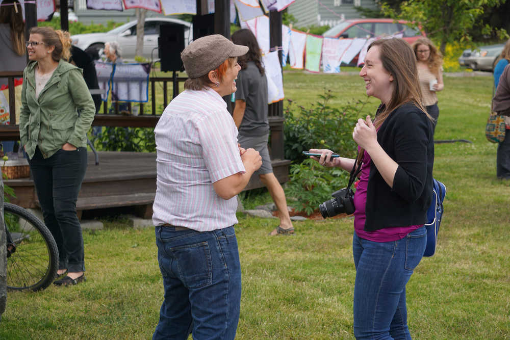 Homer News reporter Anna Frost talks with Rachel Romberg last Friday.
