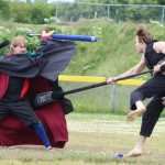 Levi Catlin and Roy Bellamy fight during a play battle with Homer's live action role play group on Saturday, June 18 at Karen Hornaday Park. The group's name is the Shire of IceFire Bay, within which Catlin and Bellamy are known as Leviticus Niltac and Grimmjow, respectively.