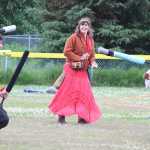 Rowyn Cunningham and Sage Thomas prepare to battle each other as Samantha Cunningham looks on. The Shire of IceFire Bay meets on Saturday afternoons from 4-7 p.m. at Karen Hornaday Park to play battle games.