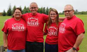 Robin, David, April and Doug Stammen pose for a photo outside the Garden Cottage where they stayed at Bear Canyon Cottages in Homer. The Stammens were sent to Homer by A Special Wish Foundation to fulfill 16-year-old David's wish to halibut fish in Alaska.-Photo by Anna Frost, Homer News