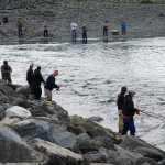 Fishermen fish during the incoming tide on Sunday at the Nick Dudiak Fishing Lagoon on the Homer Spit.