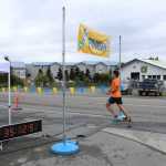 Pedro Ochoa crosses the finish line as the winner of the Spit Run on Saturday, June 25. Ochoa also finished first in the 2014 Spit Run.