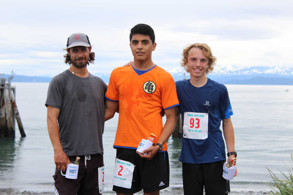 (left to right) Marlin Schuster, who took third place, Pedro Ochoa, who took first place, and Jacob Davis, who took second place, pose for a photo after completing the Spit Run on Saturday, June 25.